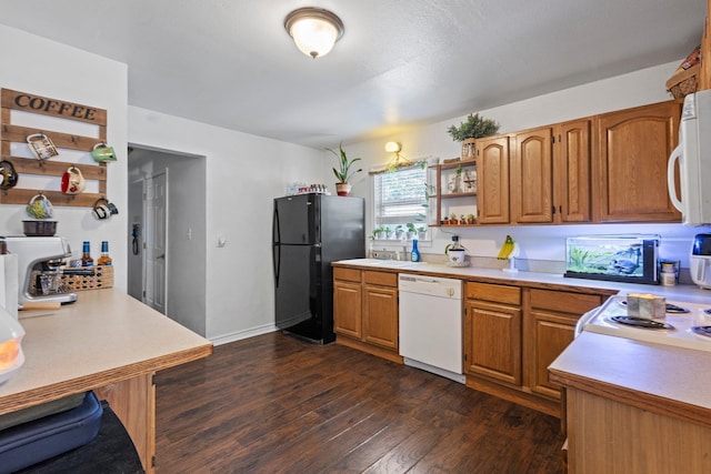 1165 Archie St, Vidor, TX 77662 - kitchen featuring white appliances, open shelves, dark wood-type flooring, and light countertops