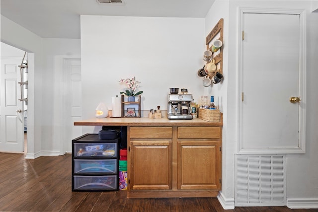 1165 Archie St, Vidor, TX 77662 - bar area with dark wood-type flooring and baseboards