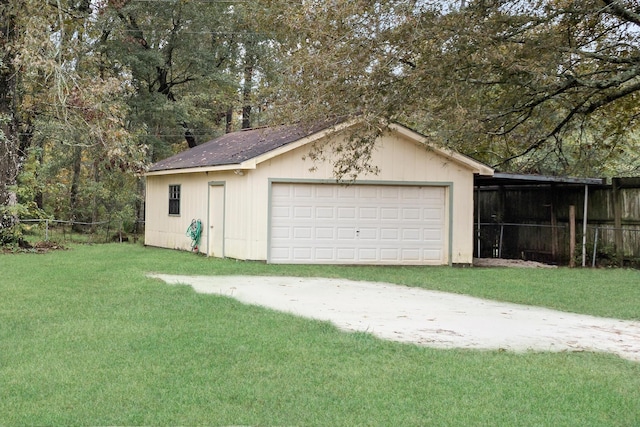 garage featuring a yard