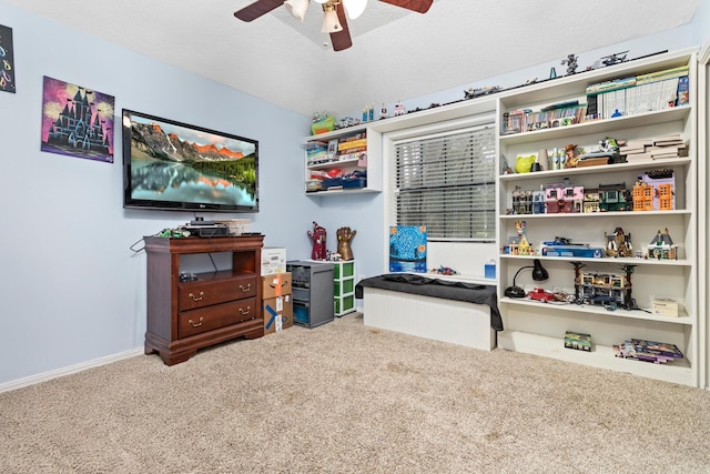 playroom featuring carpet flooring and ceiling fan