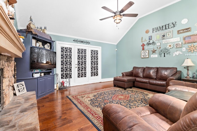 living room with hardwood / wood-style floors, ceiling fan, ornamental molding, and vaulted ceiling