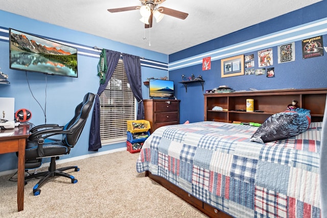 bedroom featuring a textured ceiling, carpet floors, and ceiling fan