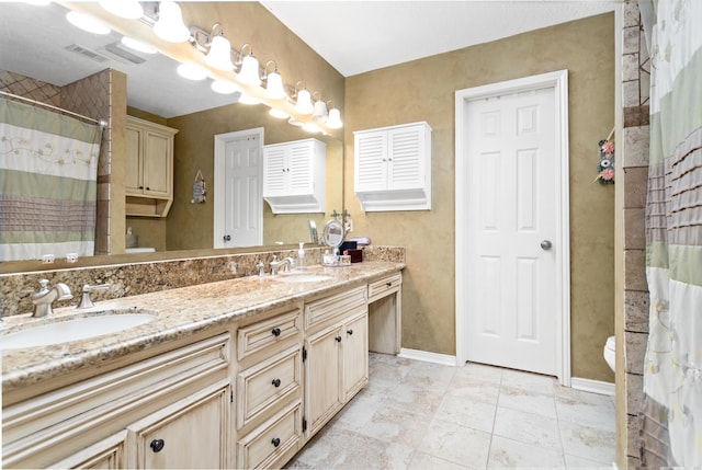 bathroom featuring tile patterned floors, vanity, toilet, and curtained shower