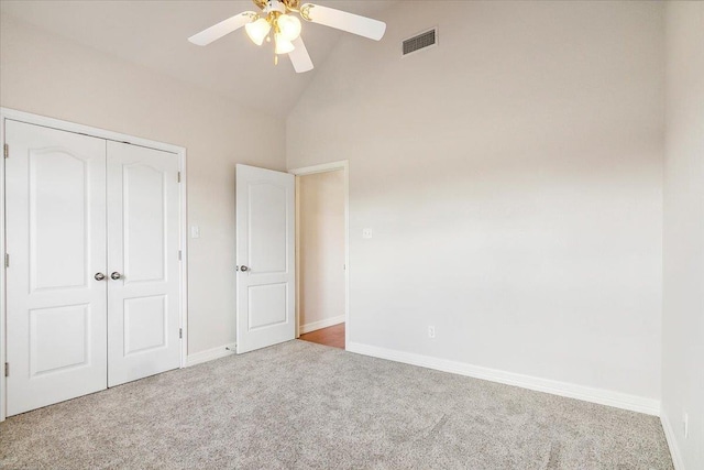 unfurnished bedroom with baseboards, visible vents, carpet floors, ceiling fan, and a closet