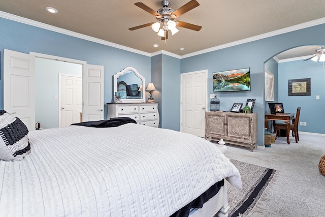 bedroom featuring a ceiling fan, ornamental molding, recessed lighting, arched walkways, and carpet flooring