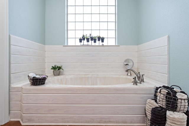 full bathroom featuring a garden tub