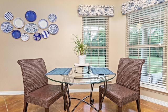 tiled dining room with baseboards