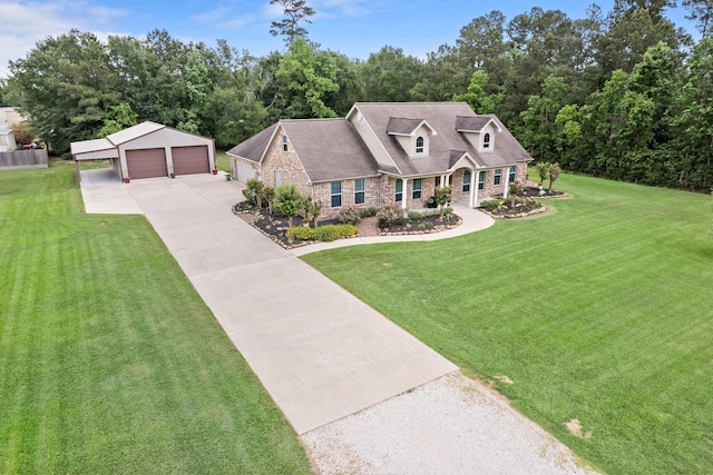cape cod-style house featuring a detached garage, an outbuilding, stone siding, and a front lawn