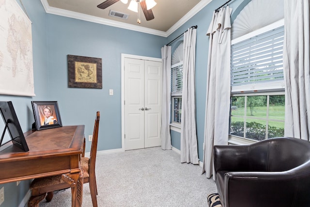 office space with ceiling fan, carpet, baseboards, visible vents, and ornamental molding