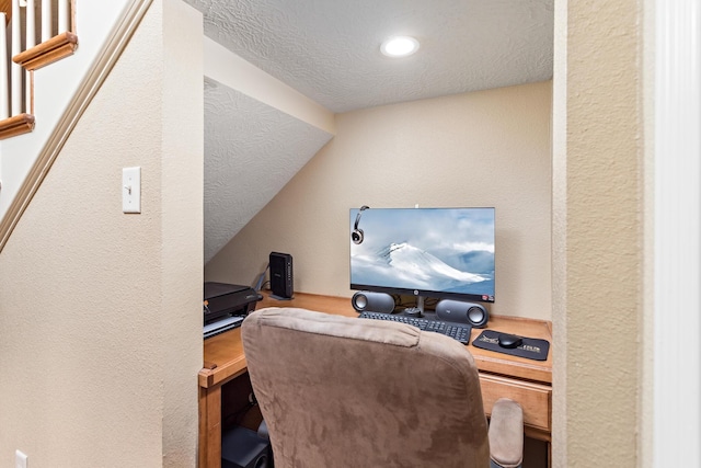 office space featuring a textured wall, recessed lighting, and a textured ceiling