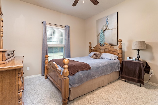 bedroom featuring baseboards, a ceiling fan, and light carpet