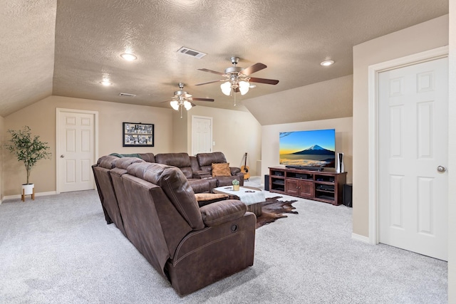 carpeted living area with baseboards, ceiling fan, vaulted ceiling, and visible vents