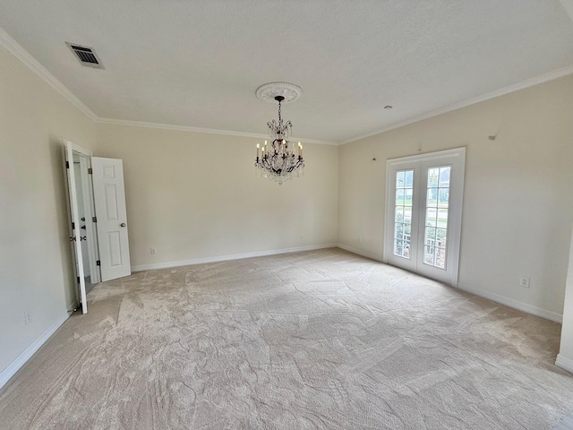 unfurnished room featuring a chandelier, visible vents, baseboards, and light colored carpet