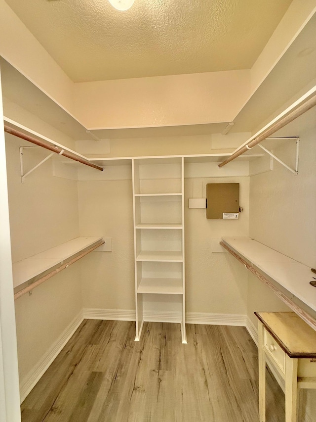 spacious closet with wood finished floors