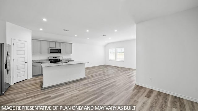 1670 Haidlyns Way, Sour Lake, TX 77659 - kitchen featuring stainless steel appliances, gray cabinetry, light countertops, light wood-type flooring, and recessed lighting
