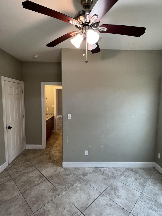 unfurnished bedroom featuring ceiling fan and light tile patterned floors