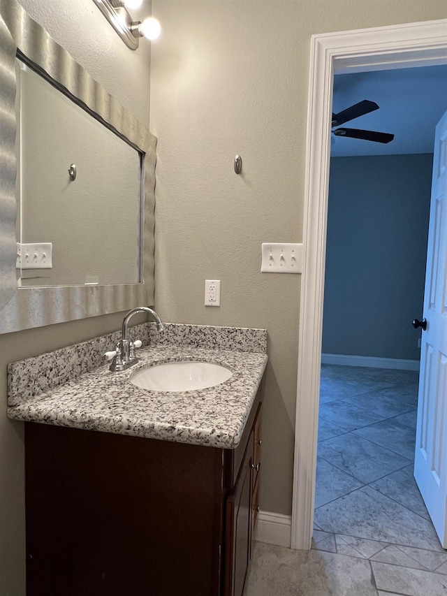 bathroom with ceiling fan and vanity