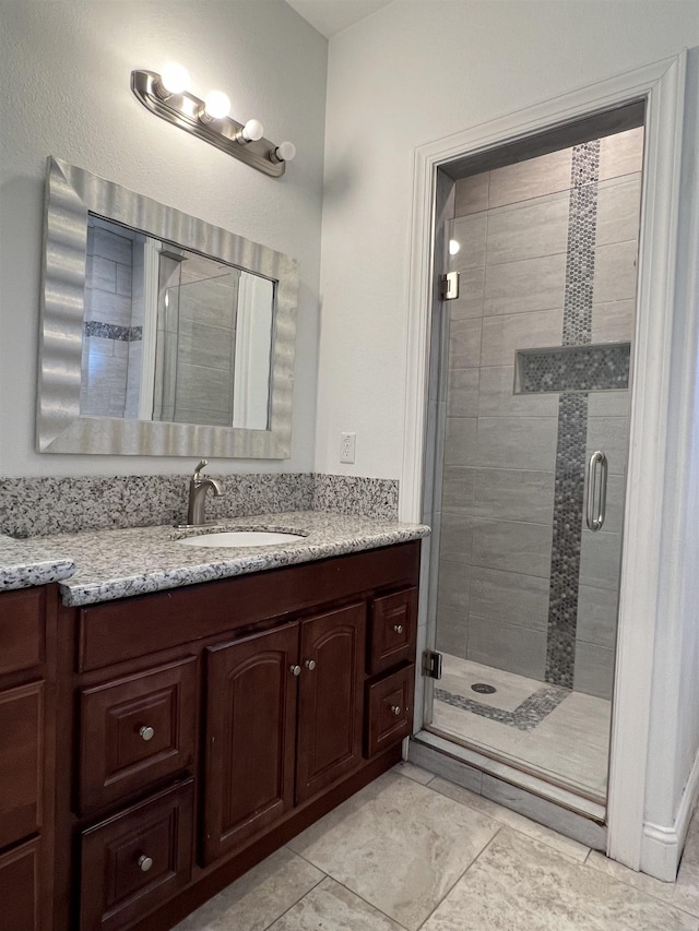 bathroom with vanity and walk in shower