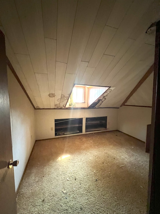 additional living space with vaulted ceiling