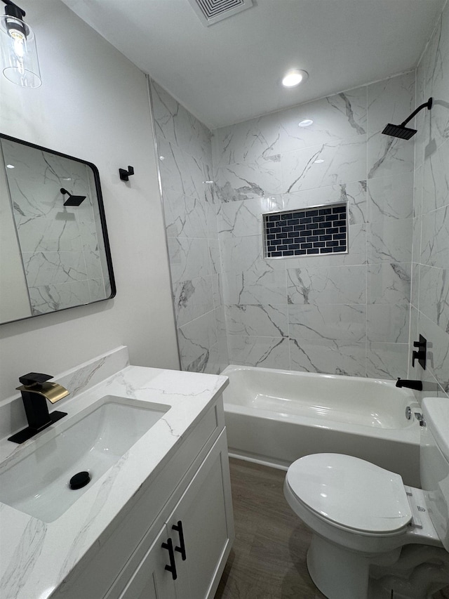 3824 Hays Ave, Groves, TX 77619 - full bathroom with vanity, washtub / shower combination, and recessed lighting