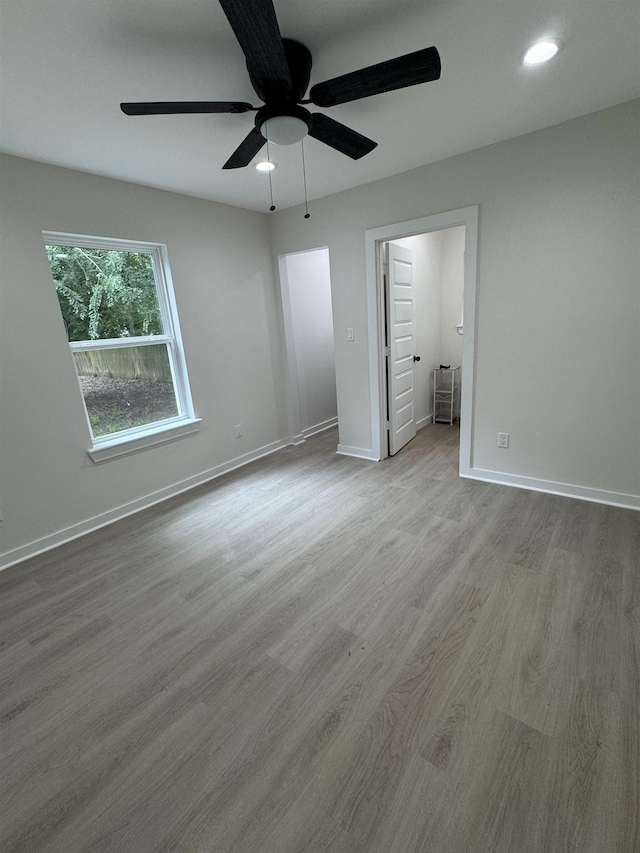 3824 Hays Ave, Groves, TX 77619 - unfurnished bedroom with wood finished floors, a ceiling fan, and recessed lighting