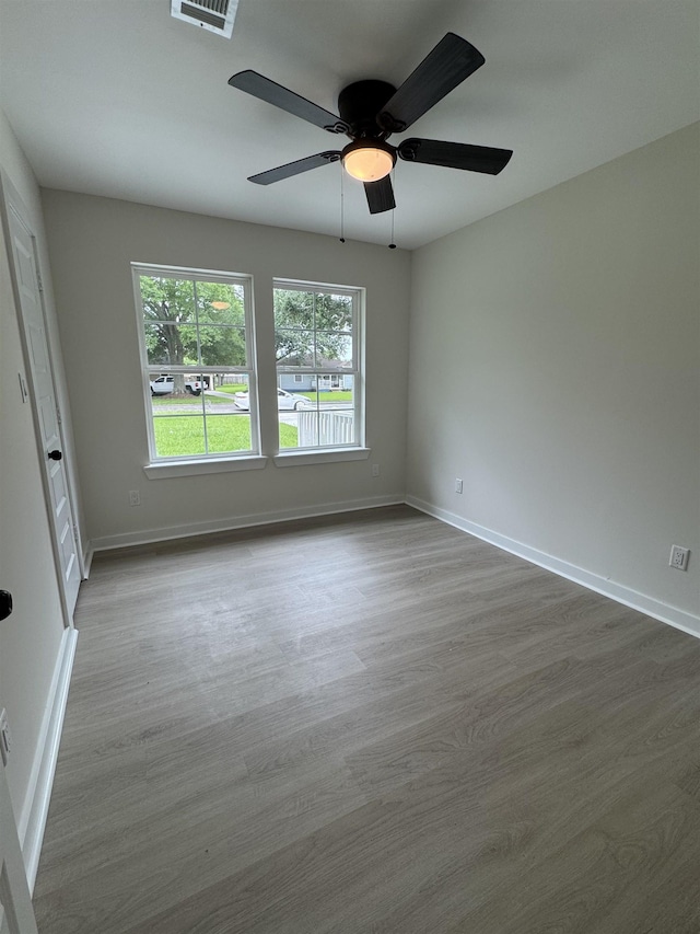 3824 Hays Ave, Groves, TX 77619 - empty room featuring wood finished floors and ceiling fan