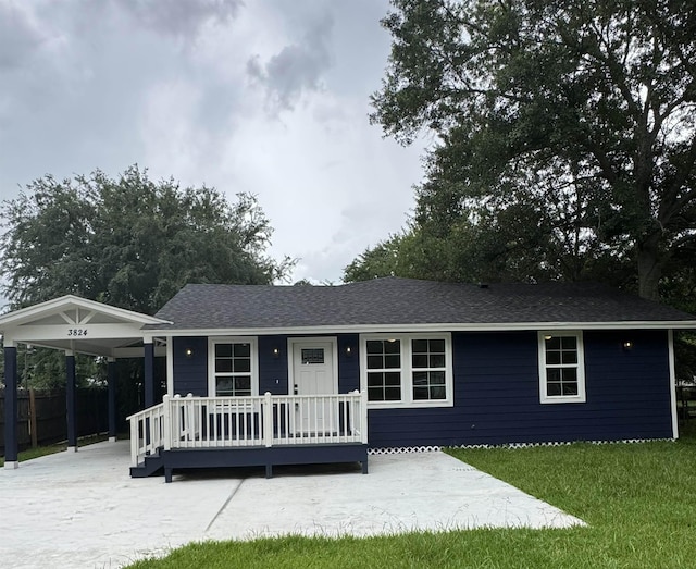 3824 Hays Ave, Groves, TX 77619 - ranch-style home with an attached carport, roof with shingles, and covered porch