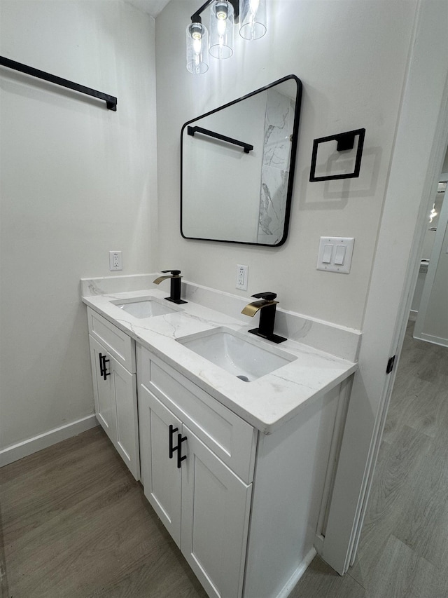 3824 Hays Ave, Groves, TX 77619 - bathroom with double vanity and wood finished floors