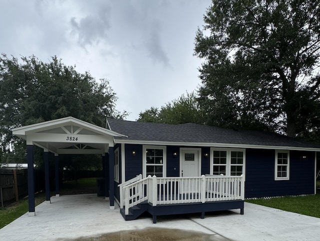 3824 Hays Ave, Groves, TX 77619 - view of front facade featuring a porch and a shingled roof