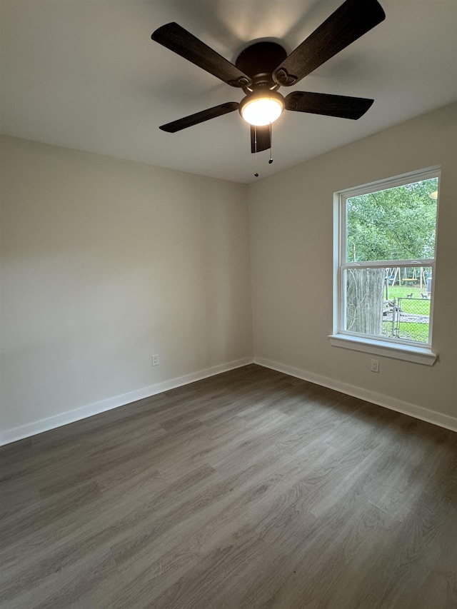 3824 Hays Ave, Groves, TX 77619 - unfurnished room with dark wood-style flooring and ceiling fan
