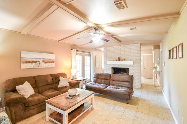 740 Randolph Cir, Beaumont, TX 77706 - living area with ceiling fan, a fireplace, light tile patterned floors, and baseboards