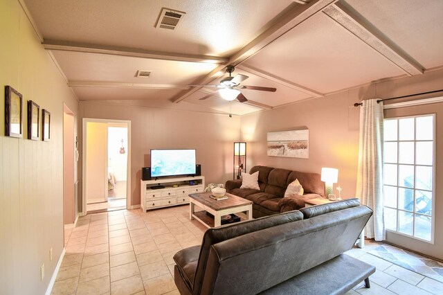 740 Randolph Cir, Beaumont, TX 77706 - living area with light tile patterned floors, plenty of natural light, a ceiling fan, and baseboards