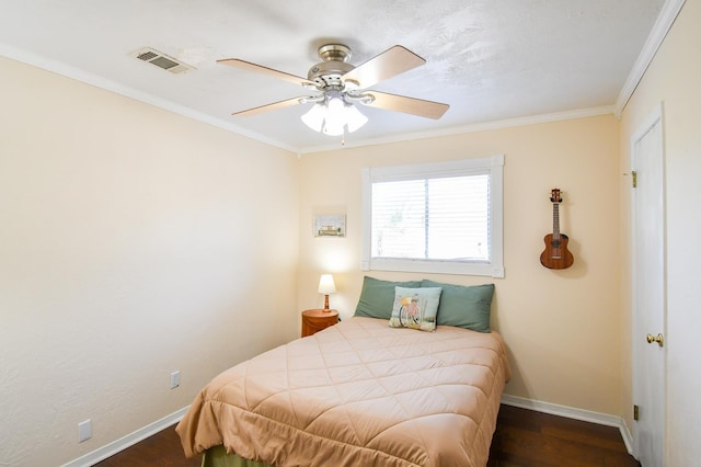 740 Randolph Cir, Beaumont, TX 77706 - bedroom featuring baseboards, wood finished floors, ornamental molding, and ceiling fan