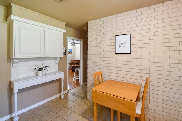 740 Randolph Cir, Beaumont, TX 77706 - dining space with ceiling fan, light tile patterned floors, and baseboards