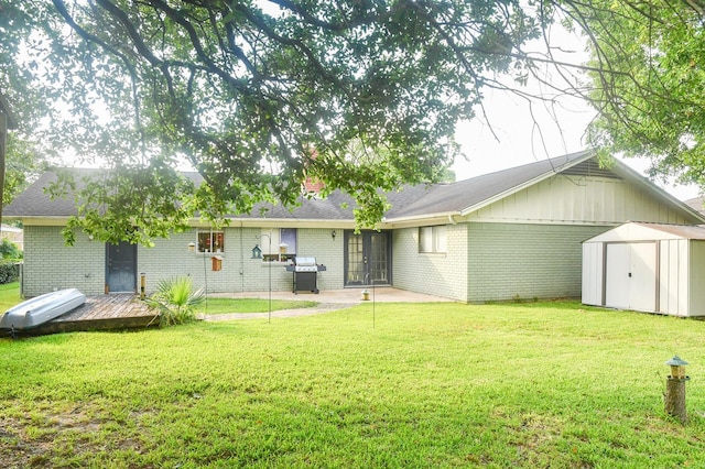 740 Randolph Cir, Beaumont, TX 77706 - back of property with brick siding, a yard, french doors, and a patio