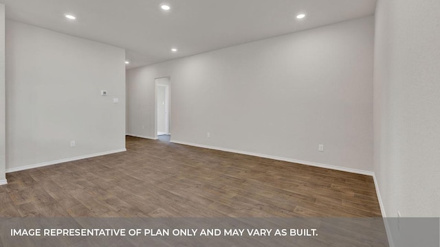 spare room featuring hardwood / wood-style floors