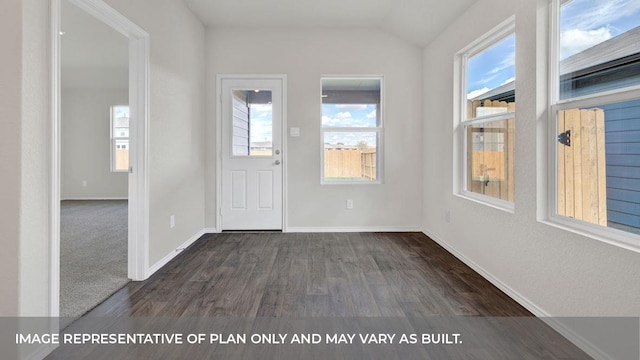 entryway with a healthy amount of sunlight, lofted ceiling, and dark wood-type flooring