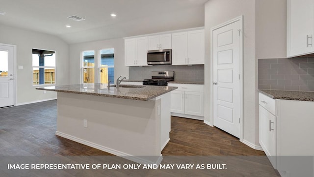 kitchen featuring white cabinets, stainless steel appliances, a center island with sink, and sink