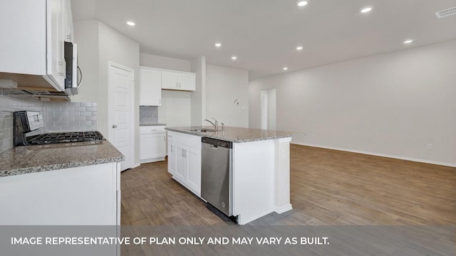 kitchen featuring white cabinets, sink, an island with sink, and stainless steel appliances