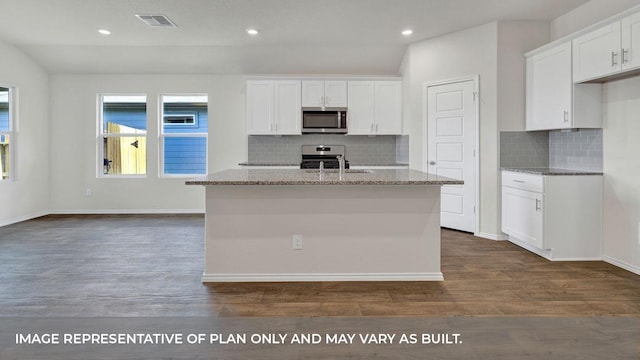 kitchen with appliances with stainless steel finishes, white cabinetry, and a kitchen island with sink