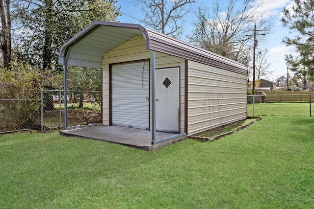 view of outdoor structure featuring a fenced backyard and an outbuilding