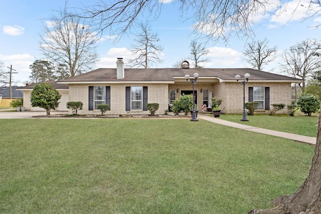 single story home with a chimney, a front lawn, and brick siding