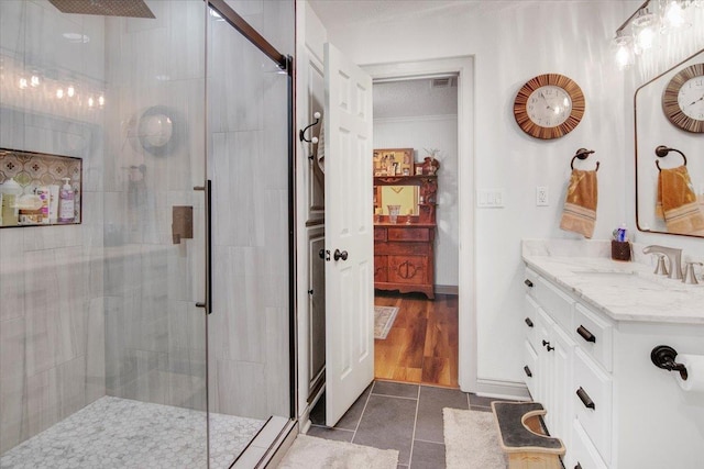2999 59th St, Port Arthur, TX 77640 - bathroom with a stall shower, tile patterned flooring, and vanity