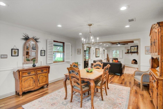 2999 59th St, Port Arthur, TX 77640 - dining area featuring a chandelier, ornamental molding, light wood-type flooring, plenty of natural light, and recessed lighting