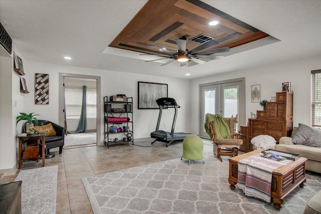 2999 59th St, Port Arthur, TX 77640 - living area featuring a raised ceiling, a ceiling fan, recessed lighting, and baseboards
