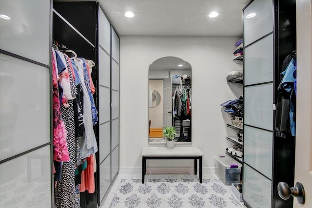2999 59th St, Port Arthur, TX 77640 - spacious closet featuring arched walkways and tile patterned flooring