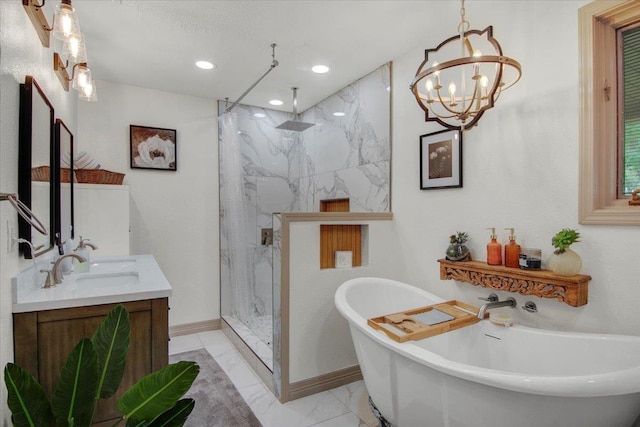 2999 59th St, Port Arthur, TX 77640 - full bath with marble look tile flooring, a marble finish shower, a chandelier, vanity, and a freestanding tub