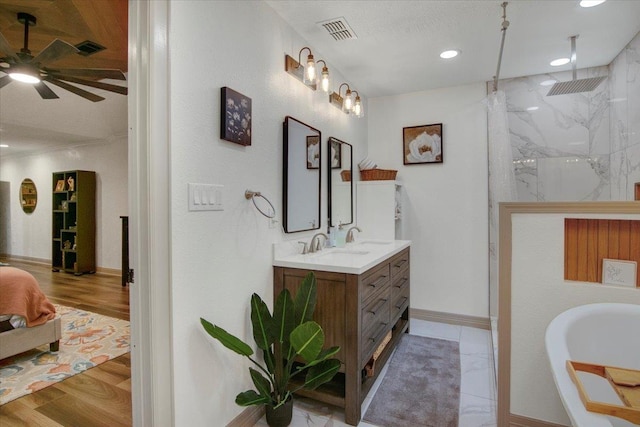 2999 59th St, Port Arthur, TX 77640 - bathroom featuring ceiling fan, a marble finish shower, vanity, wood finished floors, and baseboards