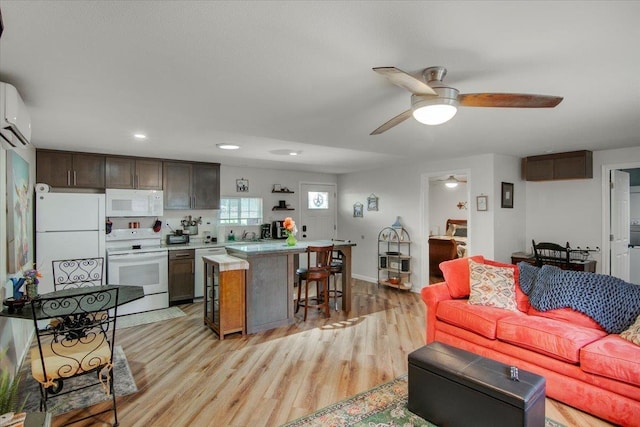 2999 59th St, Port Arthur, TX 77640 - living area featuring ceiling fan, light wood-style flooring, recessed lighting, a wall unit AC, and baseboards