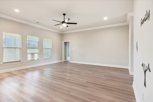 spare room with ceiling fan, light hardwood / wood-style flooring, and ornamental molding